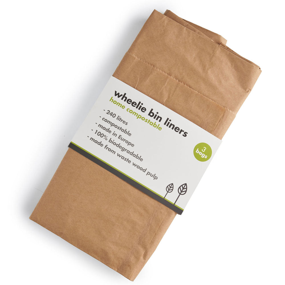 A pack of brown paper wheelie bin liners, folded and wrapped with a white paper label that reads 'wheelie bin liners' and 'home compostable'.