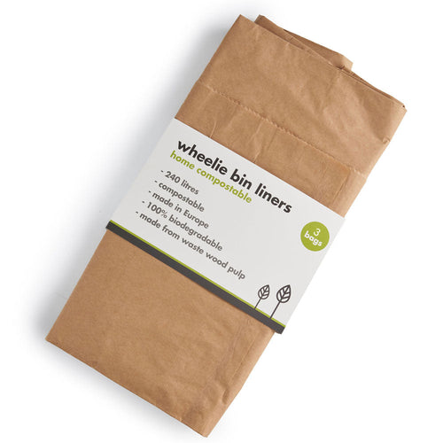 A pack of brown paper wheelie bin liners, folded and wrapped with a white paper label that reads 'wheelie bin liners' and 'home compostable'.